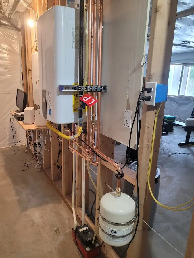 Licensed plumber repairing a kitchen sink in Ligonier